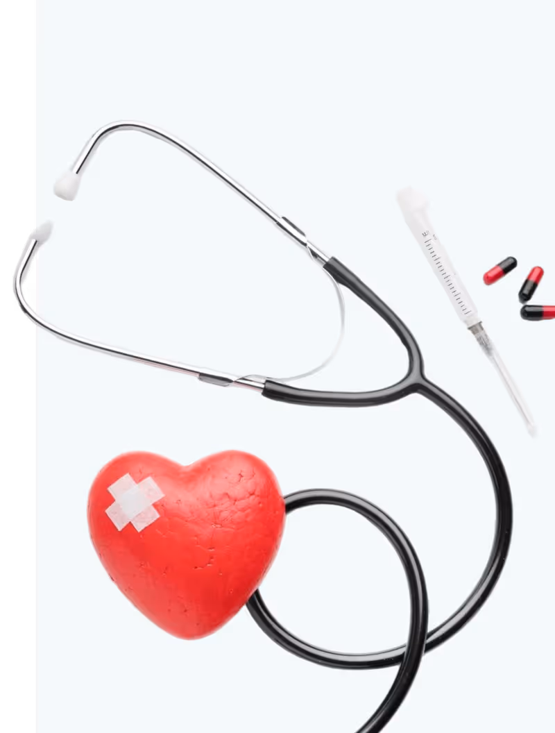 Stethoscope with a red heart-shaped object patched on one side, accompanied by a thermometer and red and black capsules on a white background.